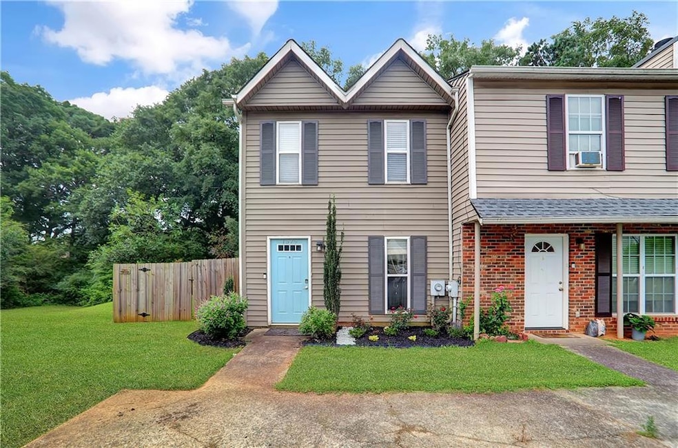 View of property featuring brick siding