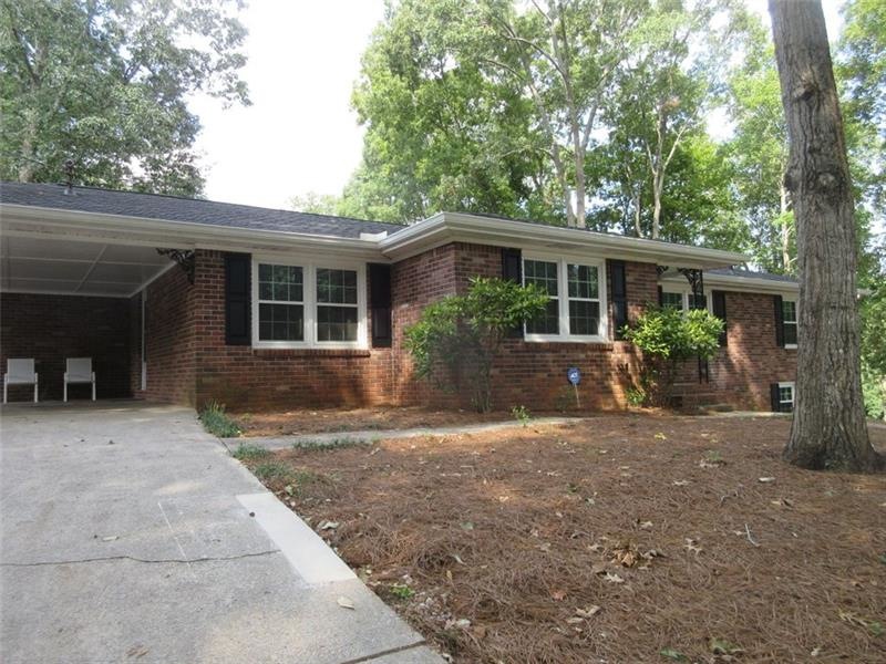Front exterior of this four-sides brick home