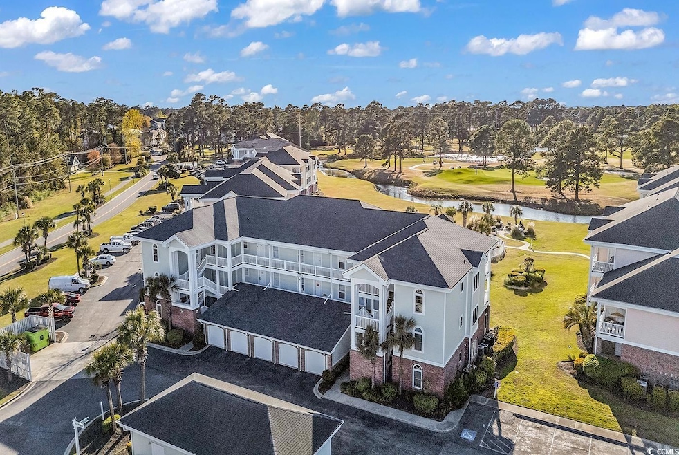 Birds eye view of property with a water view and a