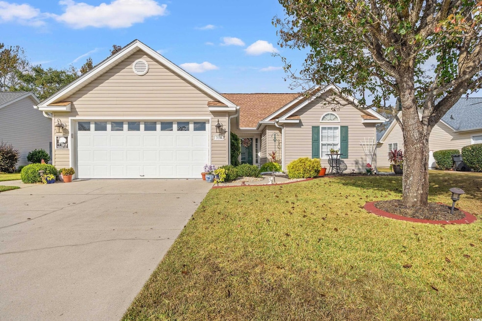 Ranch-style house featuring a garage and a front l
