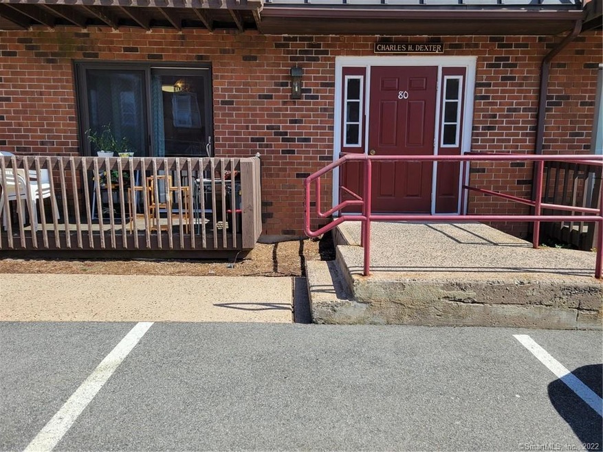 Common entrance door with handicap ramp to the lef