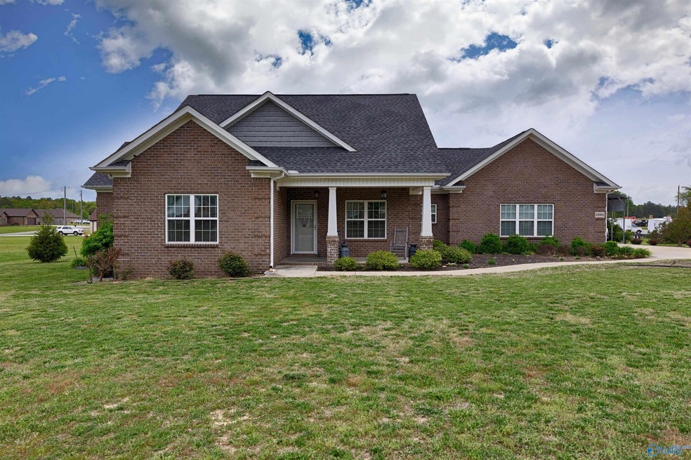 Full Brick, covered front porch with home entry, traditional landscaping