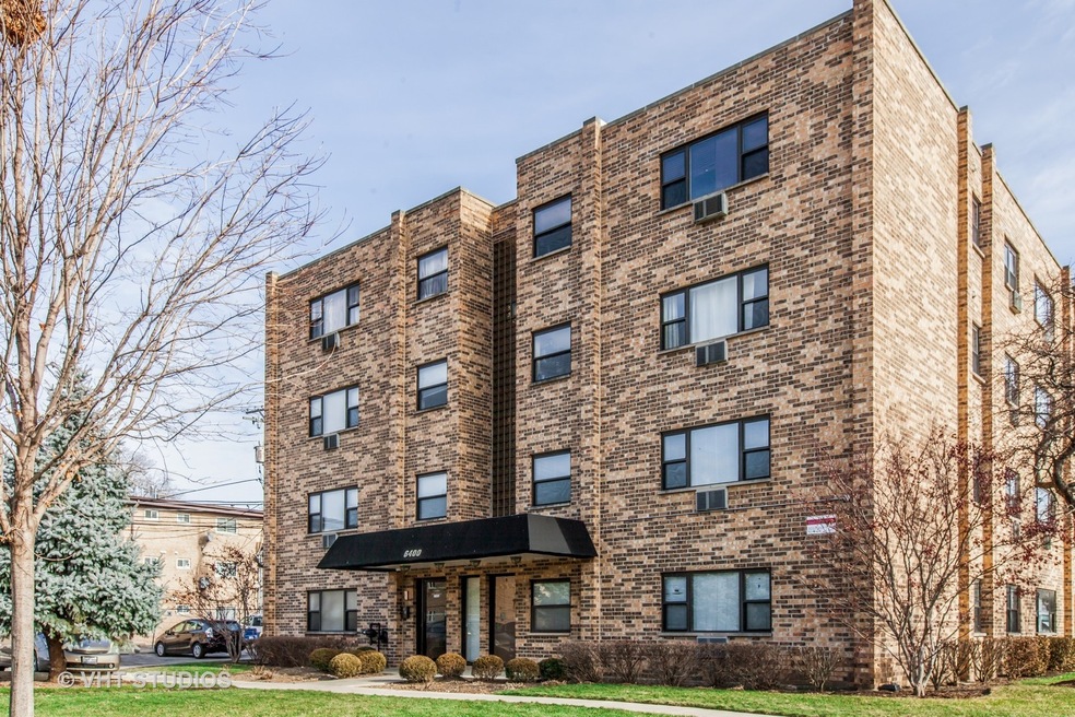 This well maintained brick building is good curb a
