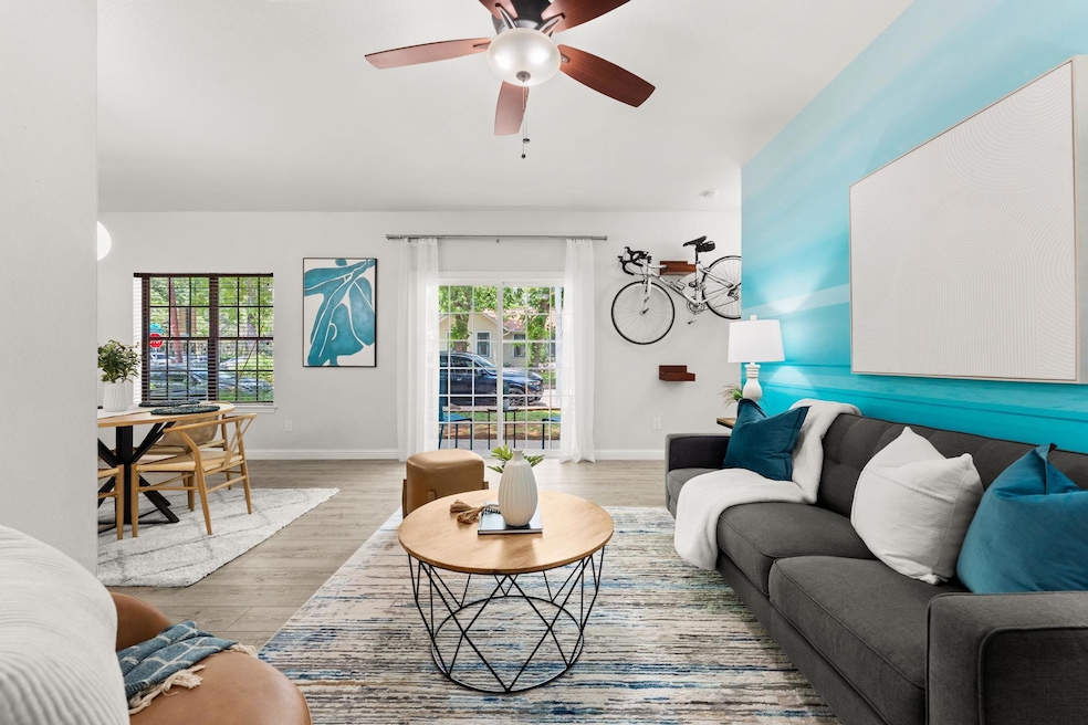 Living room featuring wood finished floors, baseb