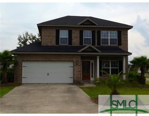 Exterior Front. Full brick former model home on la