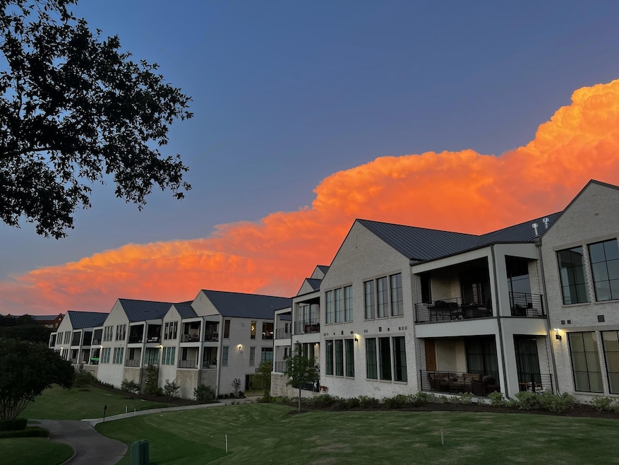 View of property at dusk