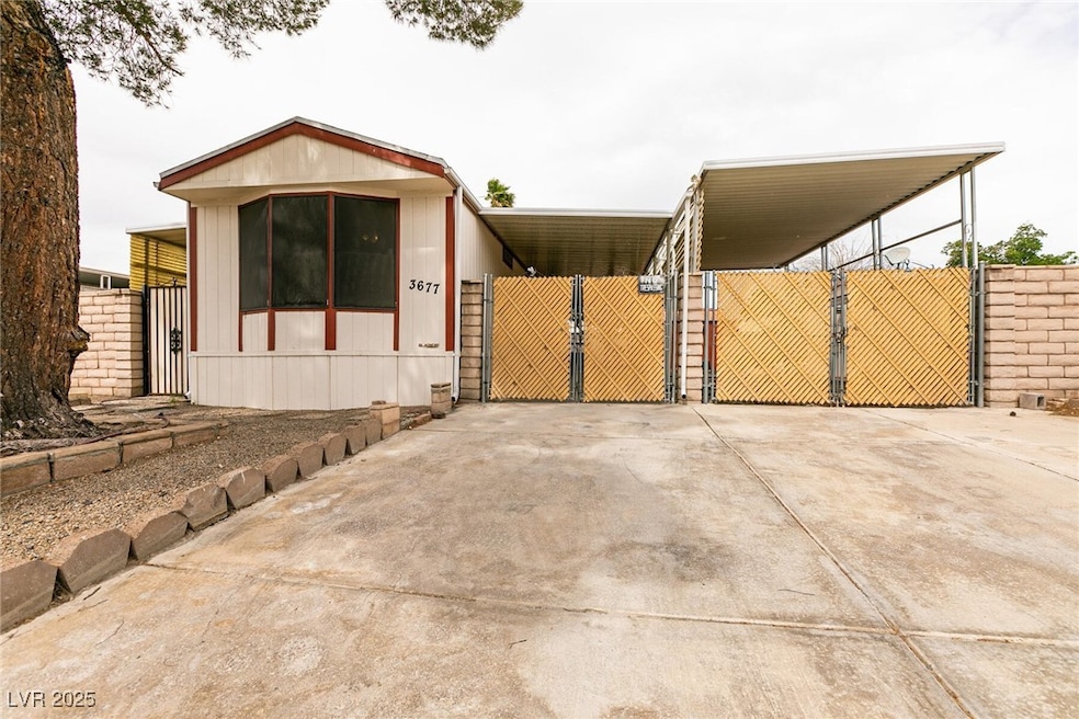 Manufactured / mobile home with a gate, fence, and