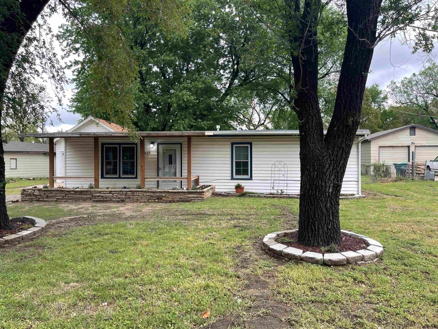 With Covered porch and adult tree's and beautiful 
