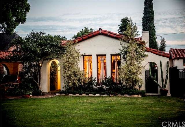 Beautiful Spanish Revival with multiple arches, fr
