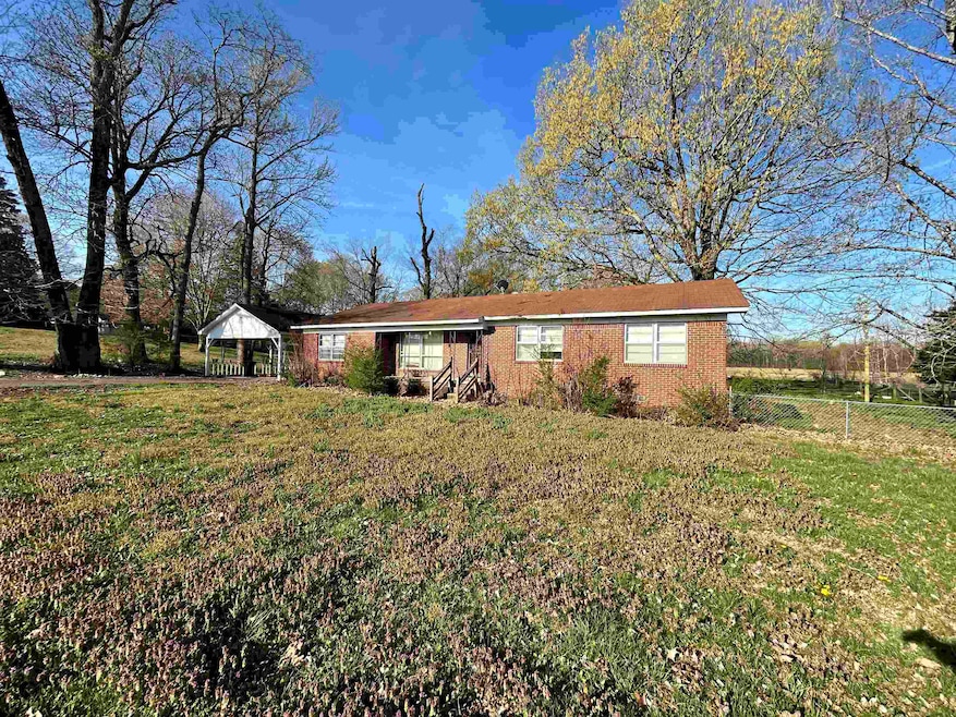 Single story home featuring a gazebo, fence, and a