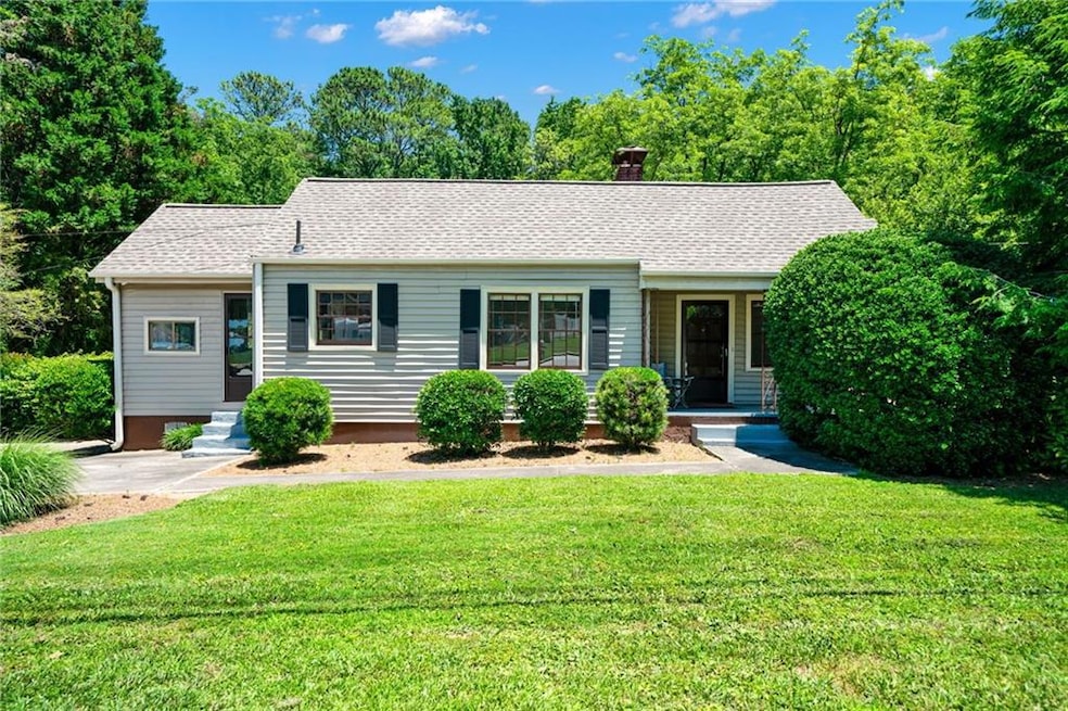 Ranch-style home featuring a front yard