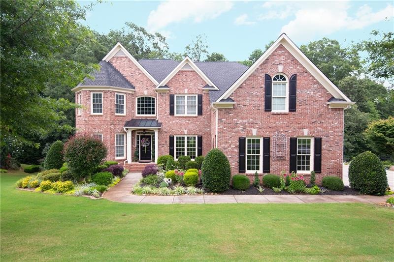 Traditional brick front beauty with brick watertab