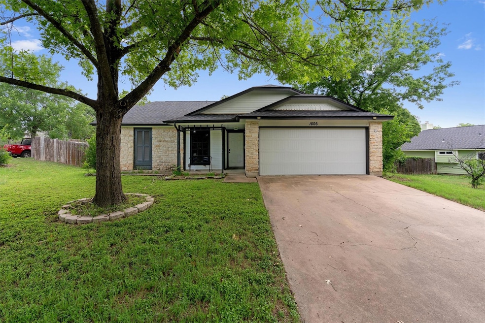 Single story home featuring an attached garage, s