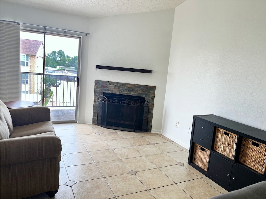 Tile floors, fireplace, high ceilings.