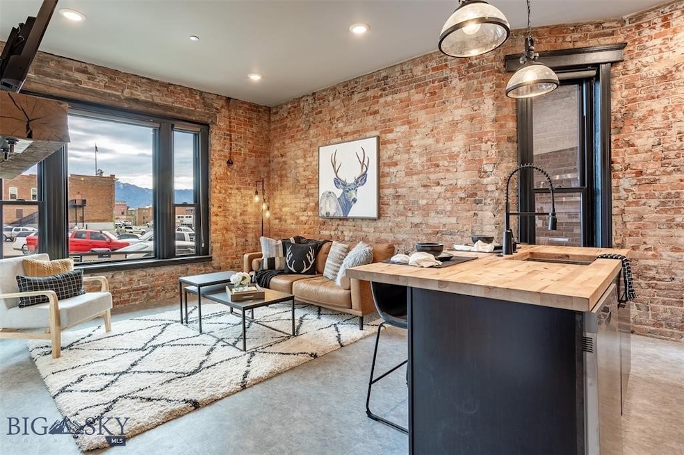 Living room featuring brick wall