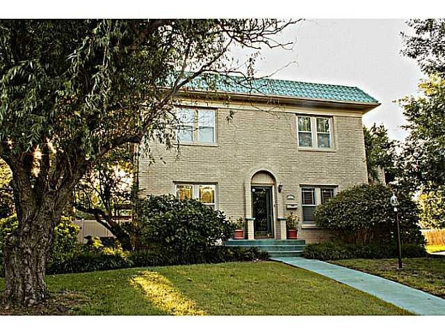 Exterior Front. Corner lot with tasteful landscapi