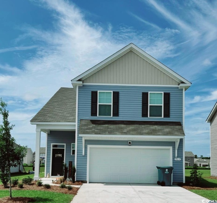 View of front of home featuring a garage