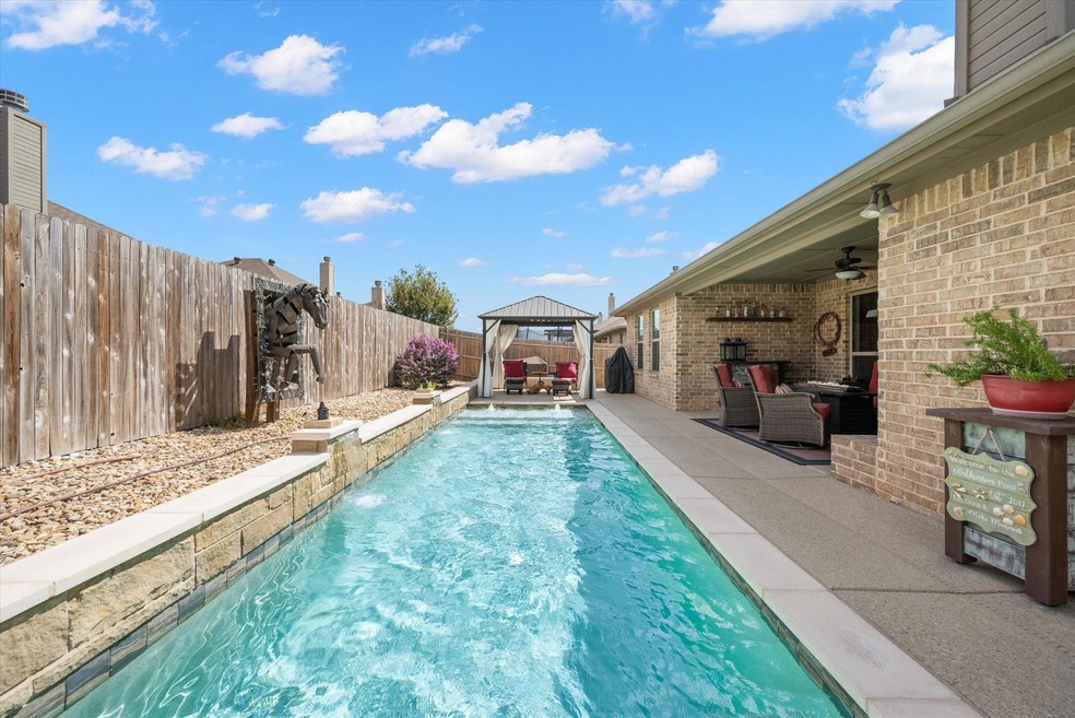 View of pool featuring a gazebo, an outdoor hangou