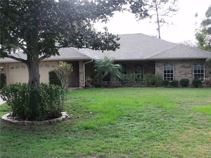 Brick/Block exterior.  High and Dry.  Beautiful Magnolia tree