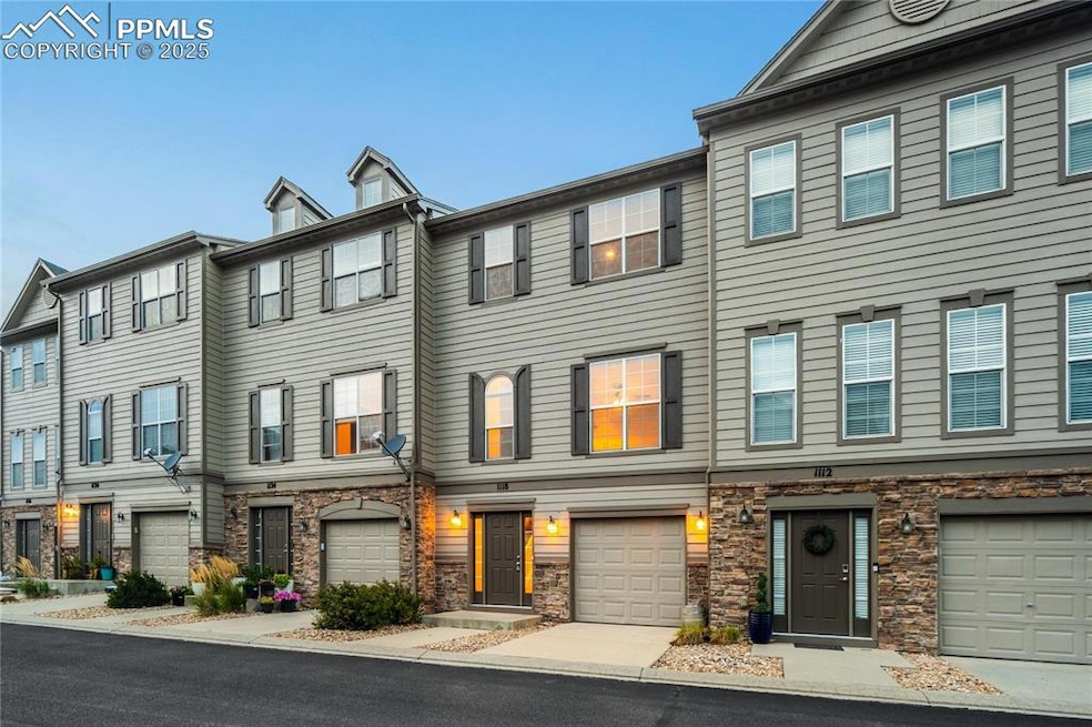 View of front of house with a residential view and stone siding