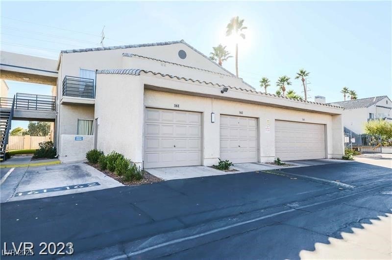 Garage featuring fence