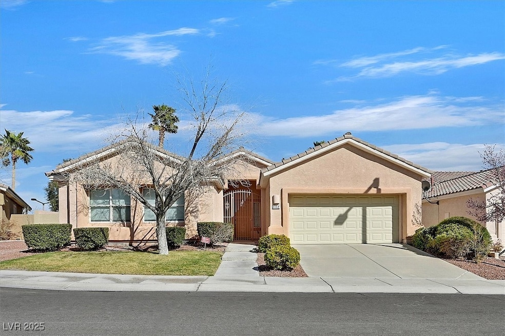 Ranch-style house with stucco siding, concrete dri