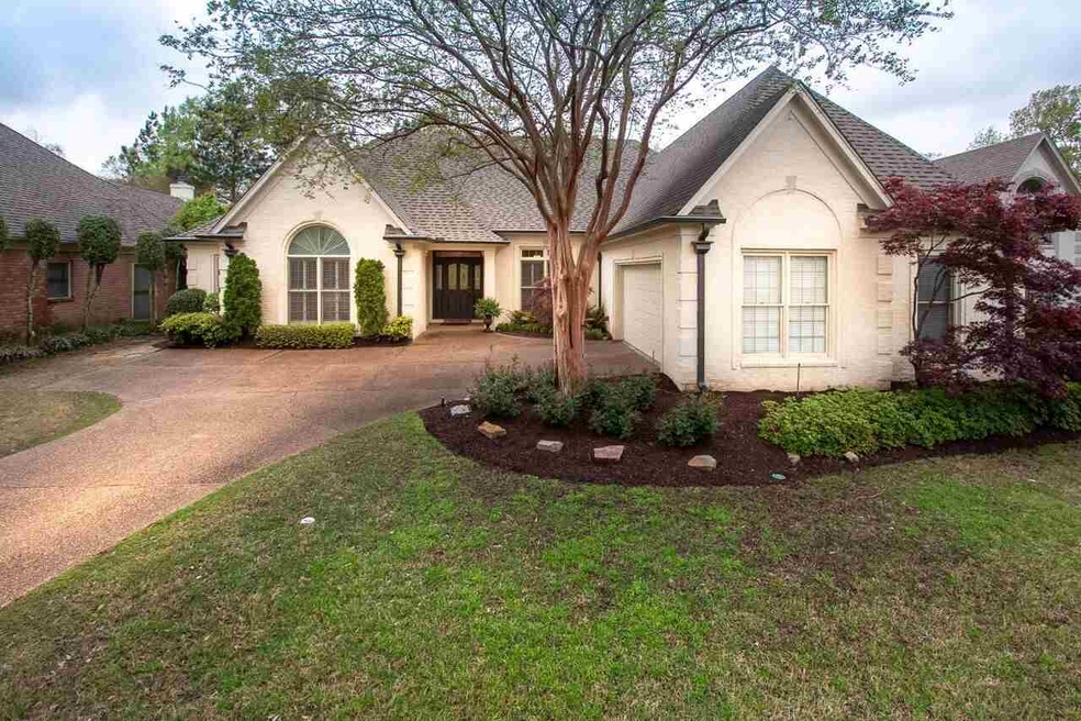 Newly slurried brick with oversized new gutters an
