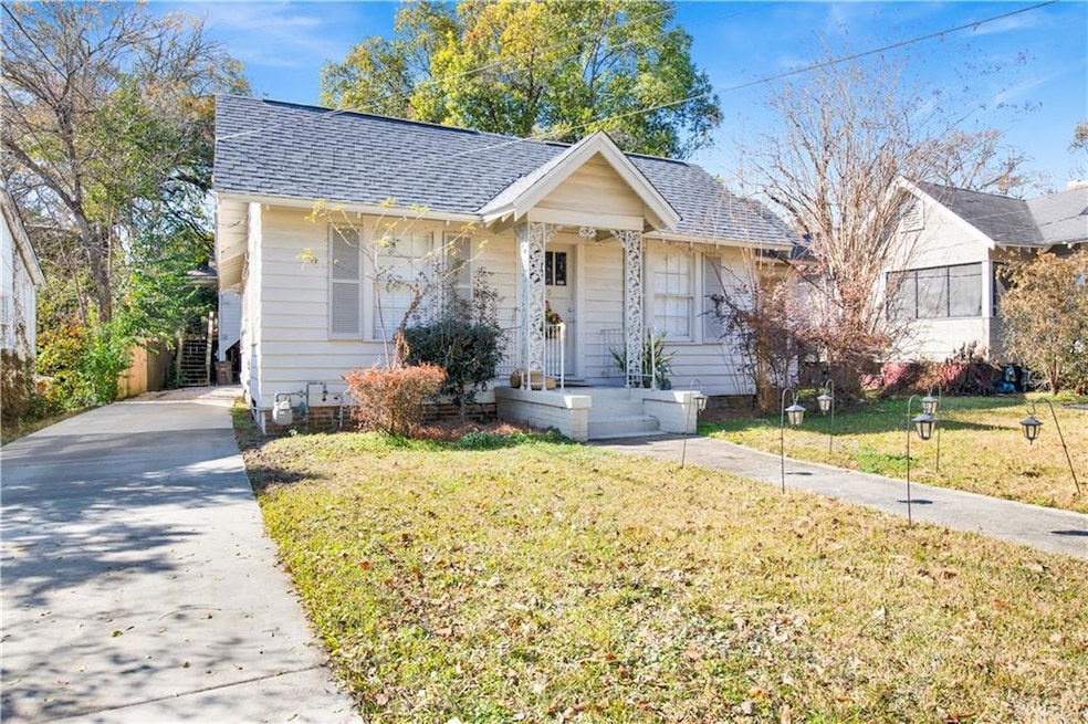 Bungalow-style house with a front lawn
