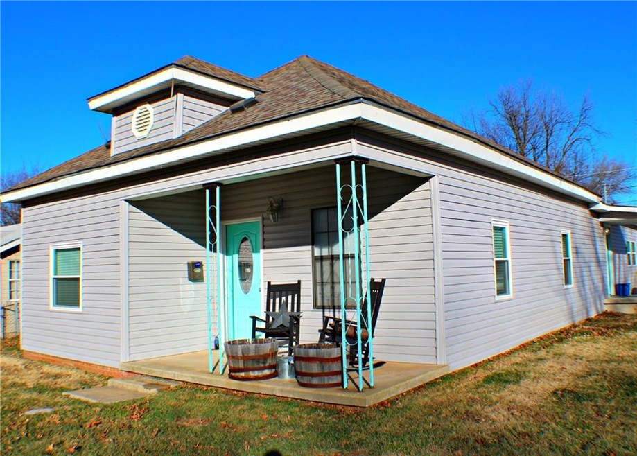 Corner lot.  Convenient side door with driveway in