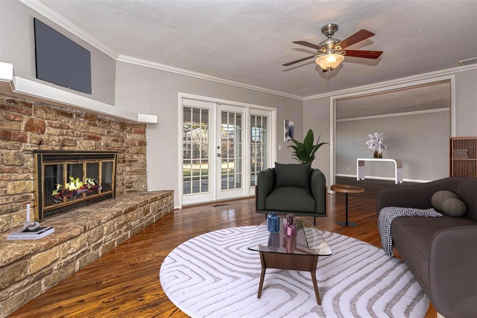 Living room featuring dark wood-type flooring, a f