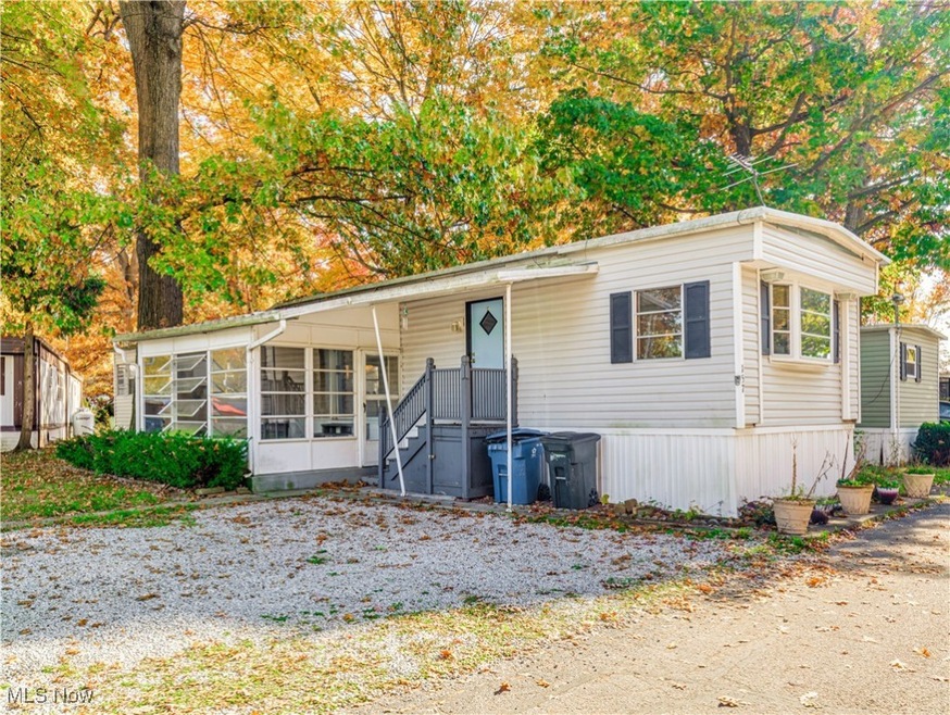 Front of mobile home with screened-in porch