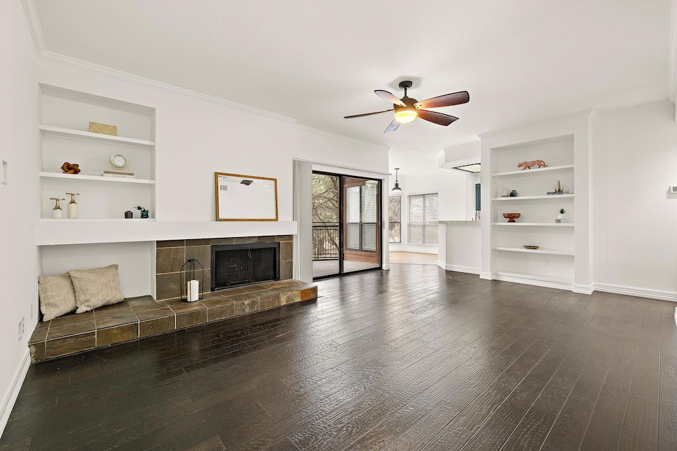 Unfurnished living room featuring dark wood finis