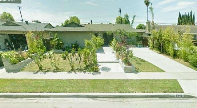 Front of Home with nice flowers and plants