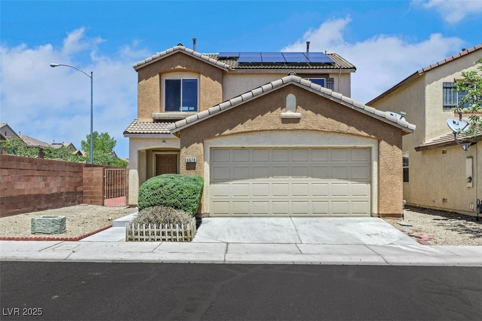 Mediterranean / spanish house featuring a tile roo