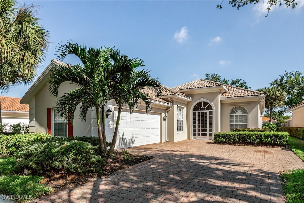 Mediterranean / spanish-style house featuring a ti