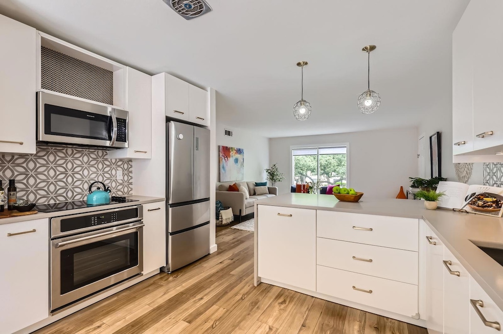 Kitchen featuring appliances with stainless steel