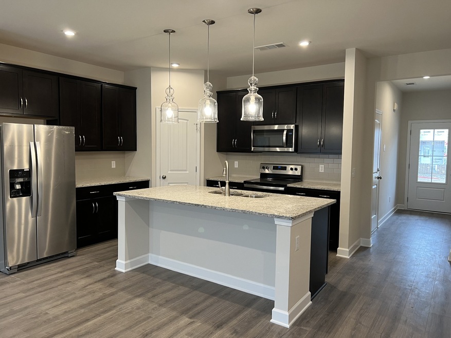 This is a photo of one of our model homes. Please know that some of the exterior and interior finishes, paint, and amenities may vary.