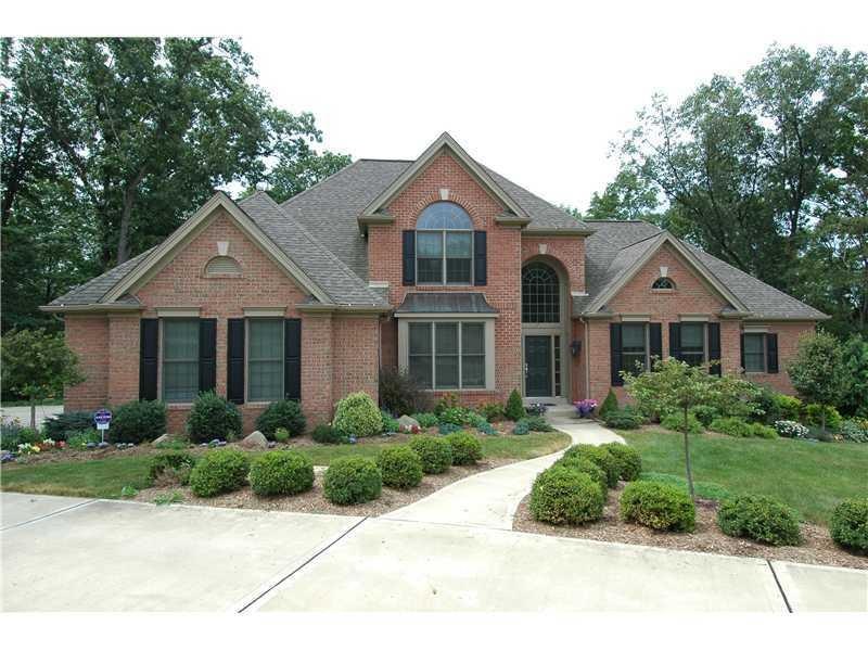 Exterior Front. Beautiful brick exterior with lush