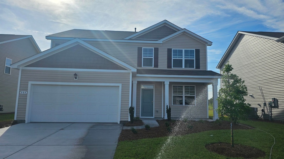 View of front of property with a garage and a fron