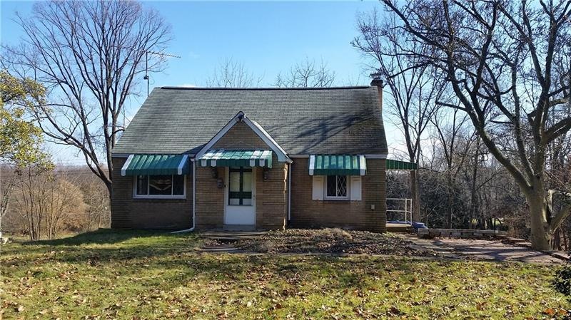 Front of home showing side porch and nice level fr