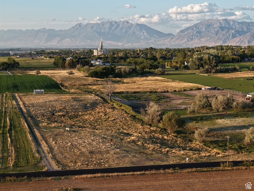 View of mountain backdrop featuring rural landscape and extensive farmland
