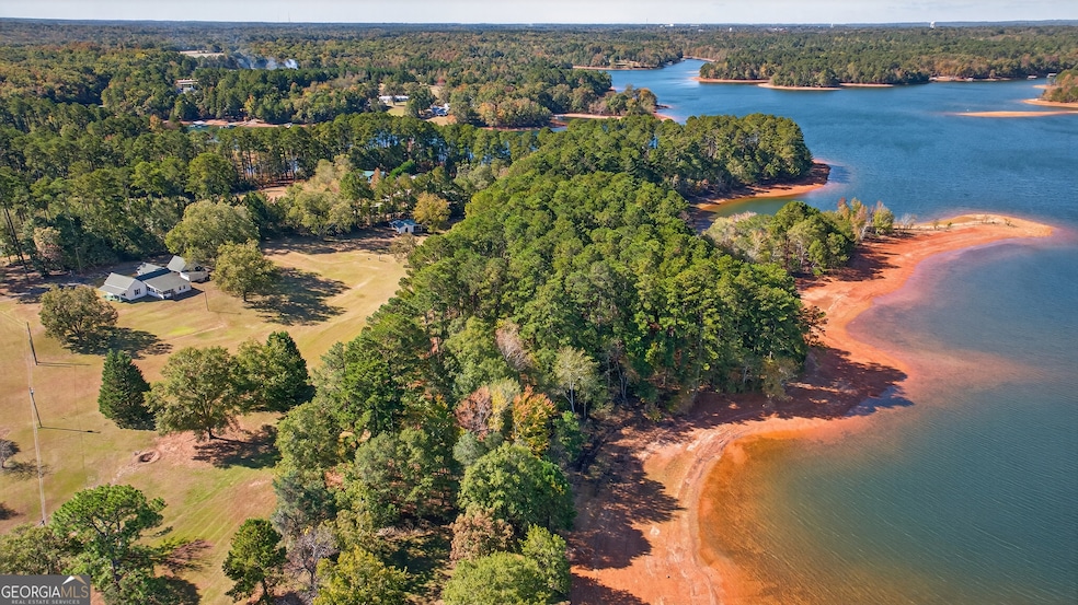 Aerial of lake and large acreage to the left