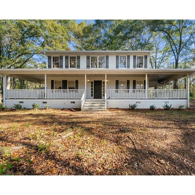 Farmhouse featuring crawl space and a large porch