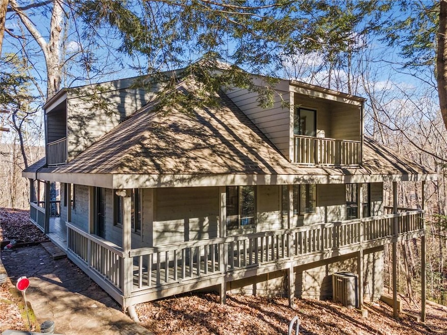 View of front of property with a balcony and cover