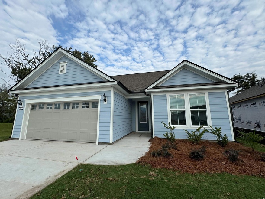 Single story home featuring a garage