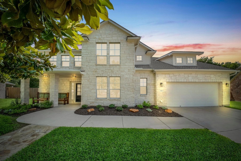 View of front of property with stone siding, an a