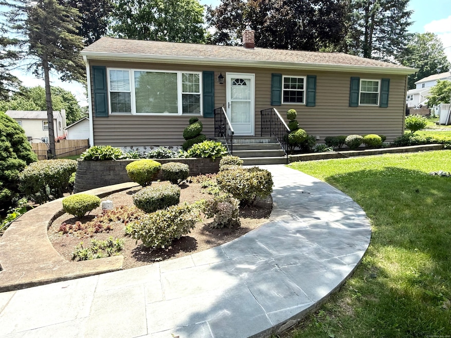 Beautiful landscaping and walkway to front door.
