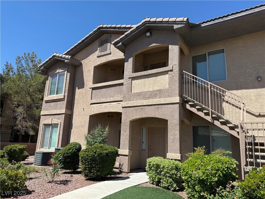 View of property featuring stairway and central AC