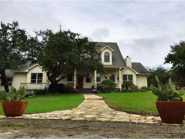 A wide front porch greets visitors to this lovely 