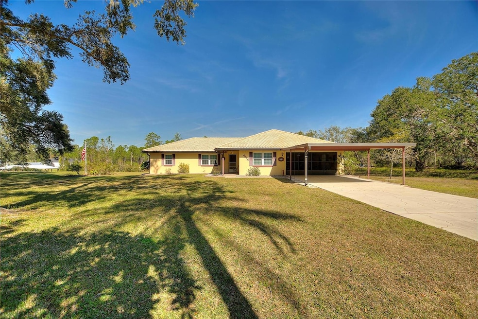 Front exterior.  Notice the long driveway and extra covered parking!